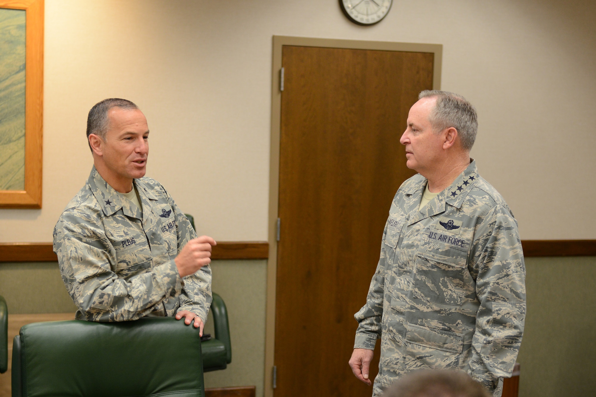 Brig. Gen. Scott Pleus, 56th Fighter Wing commander, discusses the future of Luke Air Force Base with Gen. Mark Welsh III, Chief of Staff of the U.S. Air Force. The general visited Luke to see the progress of the transition of Luke to an F-35 Lightning II joint strike fighter training base. (Senior Airman James Hensley)