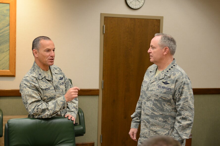 Brig. Gen. Scott Pleus, 56th Fighter Wing commander, discusses the future of Luke Air Force Base with Gen. Mark Welsh III, Chief of Staff of the U.S. Air Force. The general visited Luke to see the progress of the transition of Luke to an F-35 Lightning II joint strike fighter training base. (Senior Airman James Hensley)
