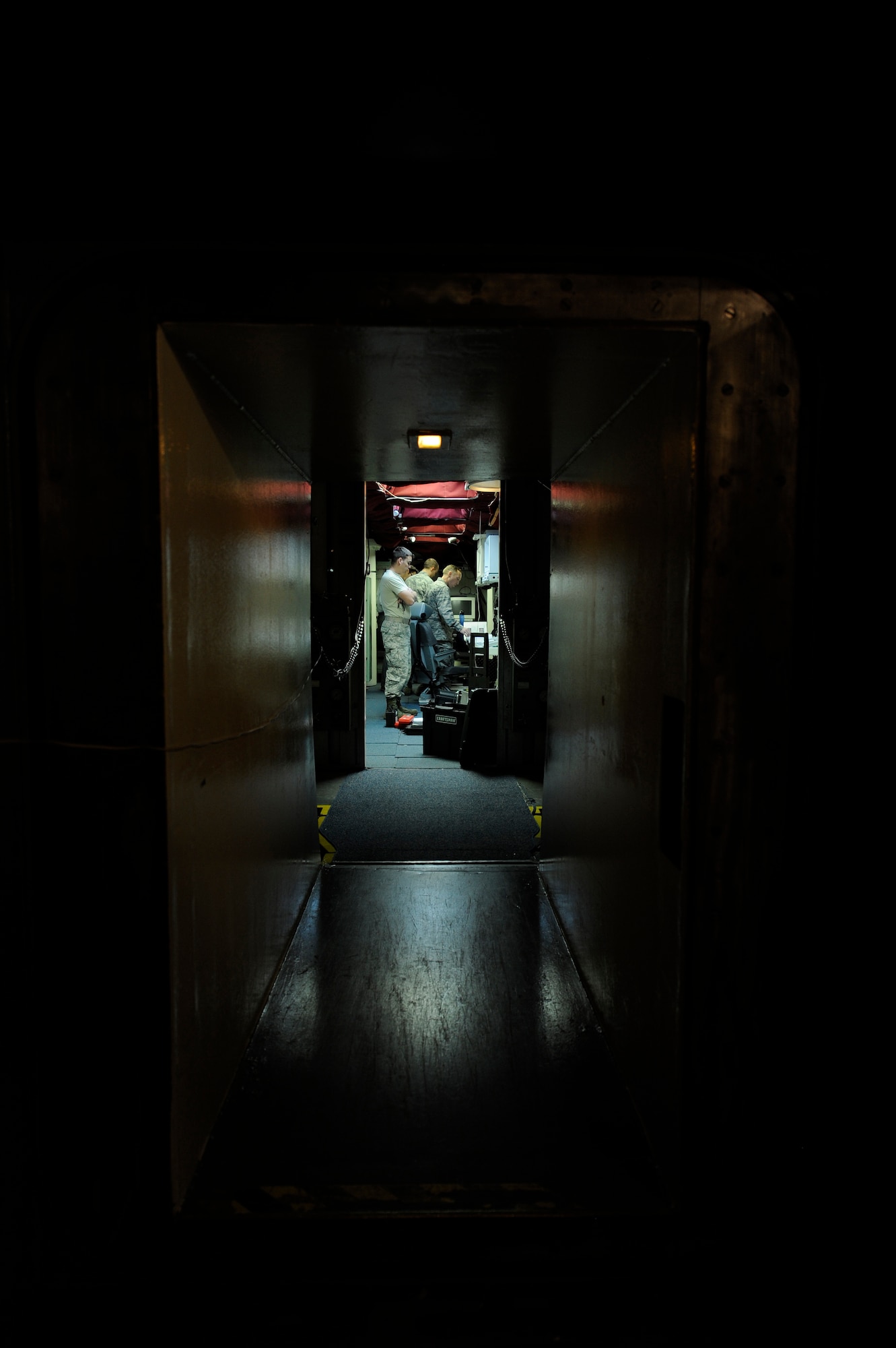Members of the 576th Flight Test Squadron install launch control panels Feb. 26, 2015, during the start-up of the Missile Alert Facility for Glory Trip-214 and Glory Trip-215 at Vandenberg Air Force Base, California. The launch control panels are a vital safeguard for launching the Minuteman III missile in both test and field environments. For the operational test launches, unarmed Minuteman III missiles are used, with specialized data monitoring and test equipment. (U.S. Air Force Photo by Airman 1st Class Ian Dudley/Released)