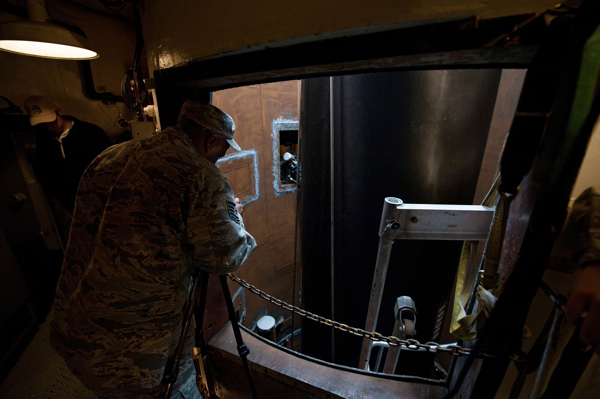 Tech. Sgt. Lundy Garlic, 576th Flight Test Squadron assistant NCOIC, Missile Maintenance Team, documents the Minuteman III booster emplacement process Feb. 25, 2015, for Glory Trip-215 at Vandenberg Air Force Base, California. The 576th FLTS, worked with Airmen from F. E. Warren and Malmstrom AFBs to prepare to unarmed Minuteman III intercontinental ballistic missiles for their respective operational test launches, verifying the capabilities of the nuclear missile leg of the nuclear triad. (U.S. Air Force photo by Michael Peterson)