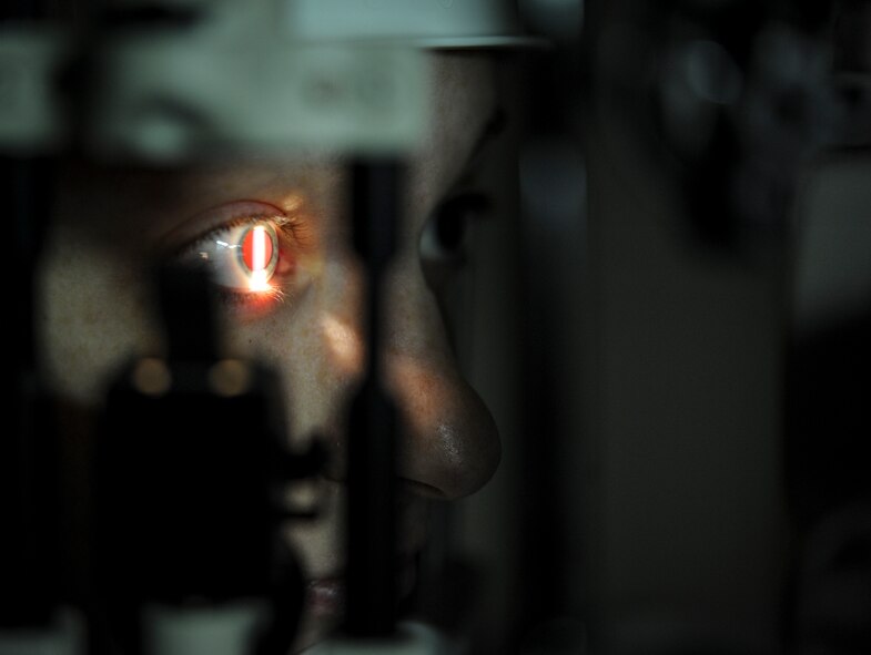 Light shines into Chelsea Hanson’s eye during an exam in the optometry clinic on Minot Air Force Base, N.D., March 23, 2015. Hanson’s eyes were dilated to allow the optometrist to view the inside of her eye. (U.S. Air Force photo/Senior Airman Stephanie Morris)