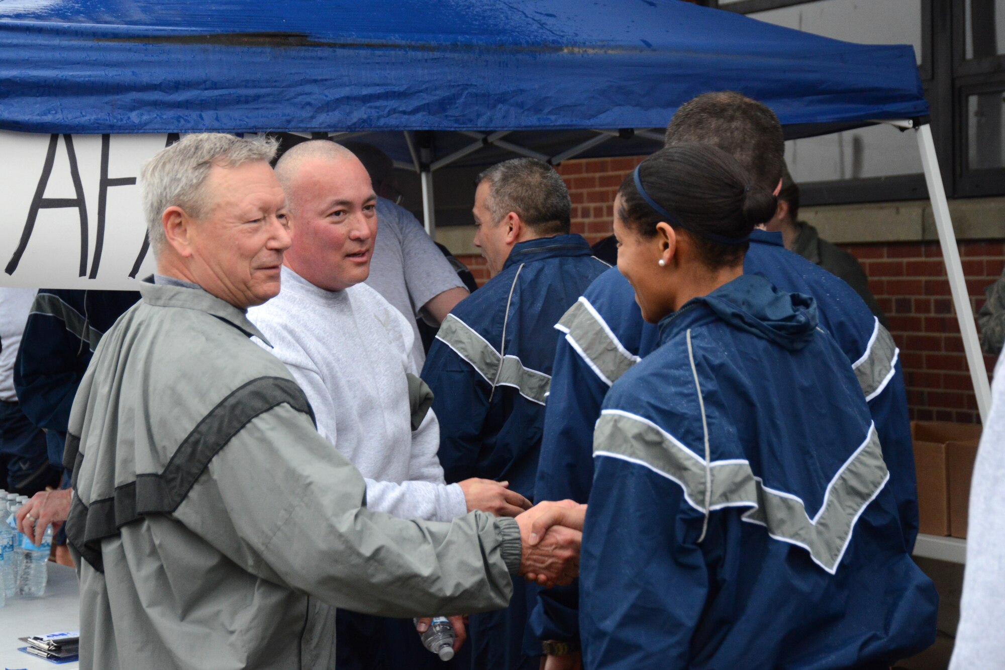 Gen. Frank J. Grass, Chief, National Guard Bureau and Chief Master Sgt. Mitchell O. Brush, National Guard Bureau senior enlisted advisor, meet Airmen from the Air National Guard Readiness Center at the ANGRC fun run held on Joint Base Andrews, Md., March 27, 2015. (U.S. Air National Guard photo by Senior Airman John E. Hillier/Released)