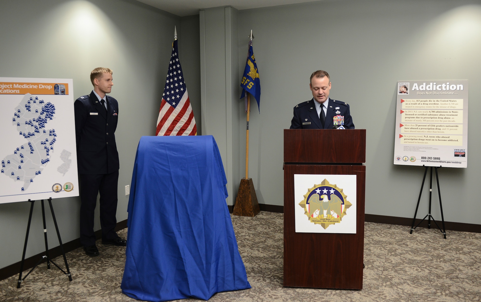 Col. James Hodges, Joint Base McGuire-Dix-Lakehurst commander, speaks at the
unveiling of the joint base's new ProjectMedicine Drop box at the 87th Security Forces Squadron building, on JB MDL,N.J. March 27, 2015. Project Medicine Drop is a way for people to discard their unwanted or expired medications anonymously at any time. (U.S. Air
Force photo by Airman 1st Class Joshua King/released)

