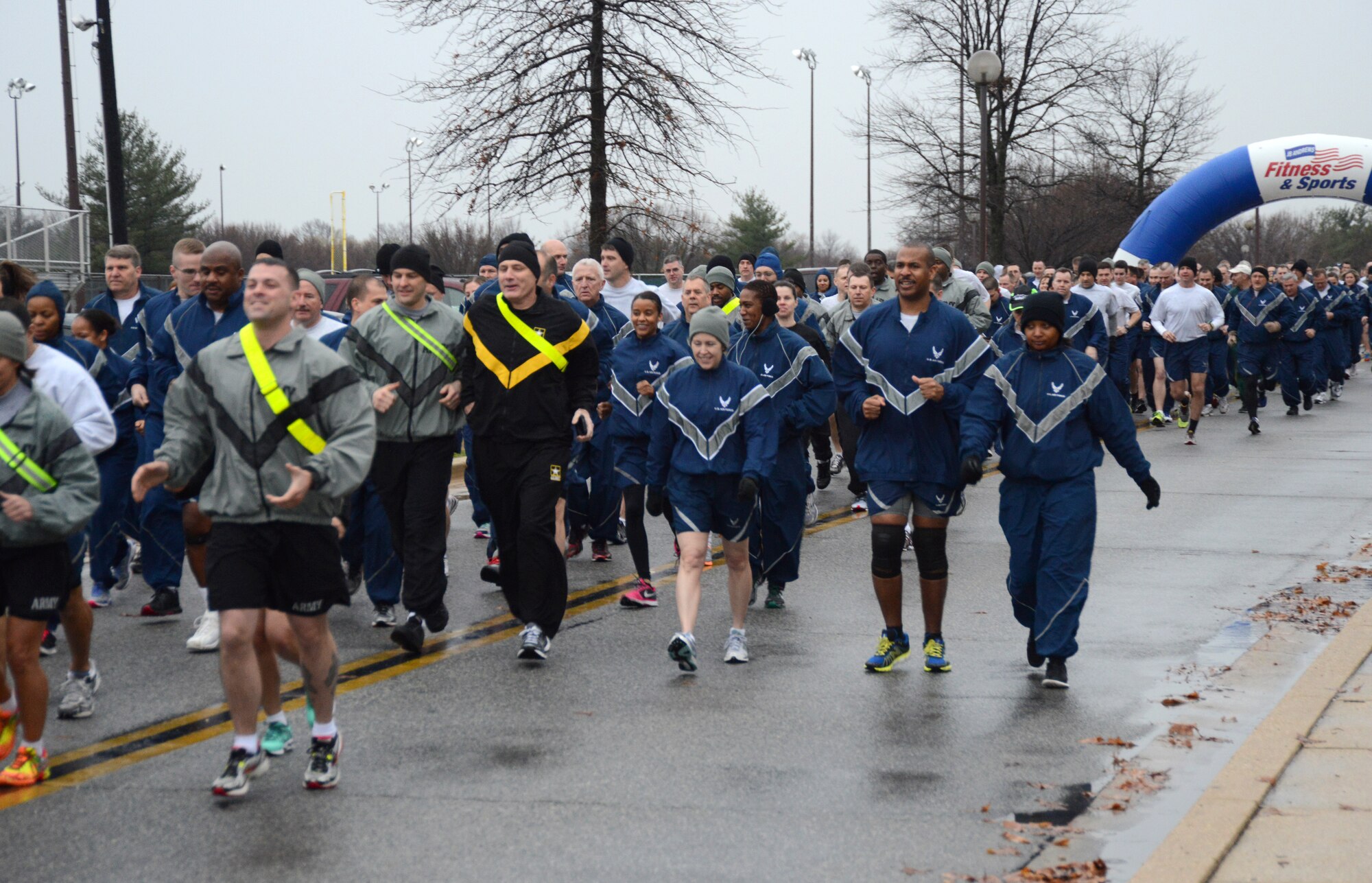 A light rain doesn't dampen Airmen and Soldiers' spirits at the Air National Guard Readiness Center fun run held at Joint Base Andrews, Md., March 27, 2015. (U.S. Air National Guard photo by Senior Airman John E. Hillier/Released)