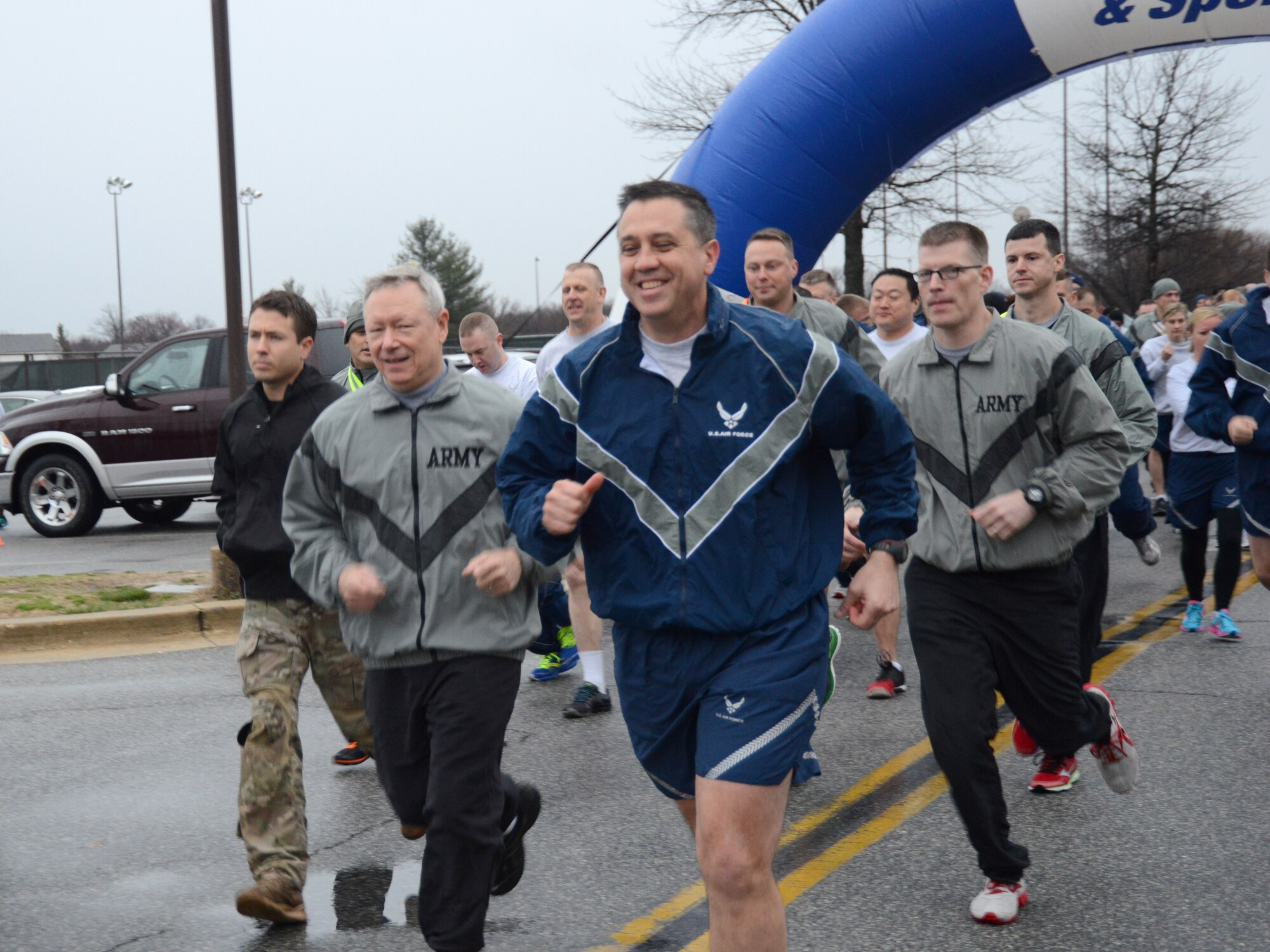 Gen. Frank J. Grass, Chief, National Guard Bureau and Brig. Gen. Michael R. Taheri, Air National Guard Readiness Center commander, lead off an ANGRC fun run held at Joint Base Andrews, Md., March 27, 2015. (U.S. Air National Guard photo by Senior Airman John E. Hillier/Released)