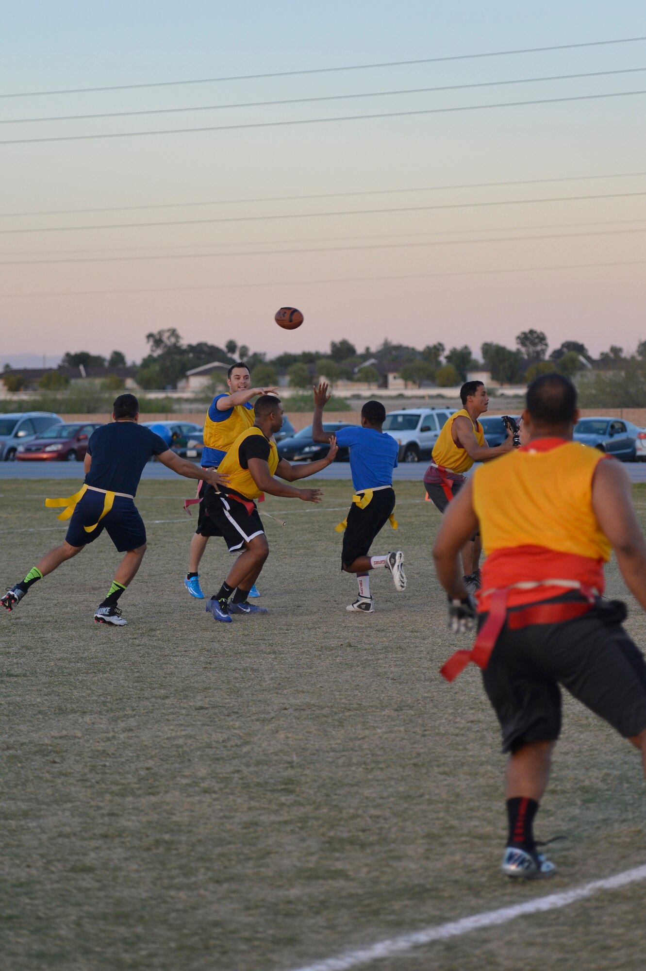 James Smith, 56th Operations Support Squadron quarterback, passes the ball during a game against the 56th Medical Group March 16 at Luke Air Force Base. The 56th MDG team put up heavy defense but the Airmen from the 56th OSS came out on top 21-18. (U.S. Air Force photo/Senior Airman James Hensley)