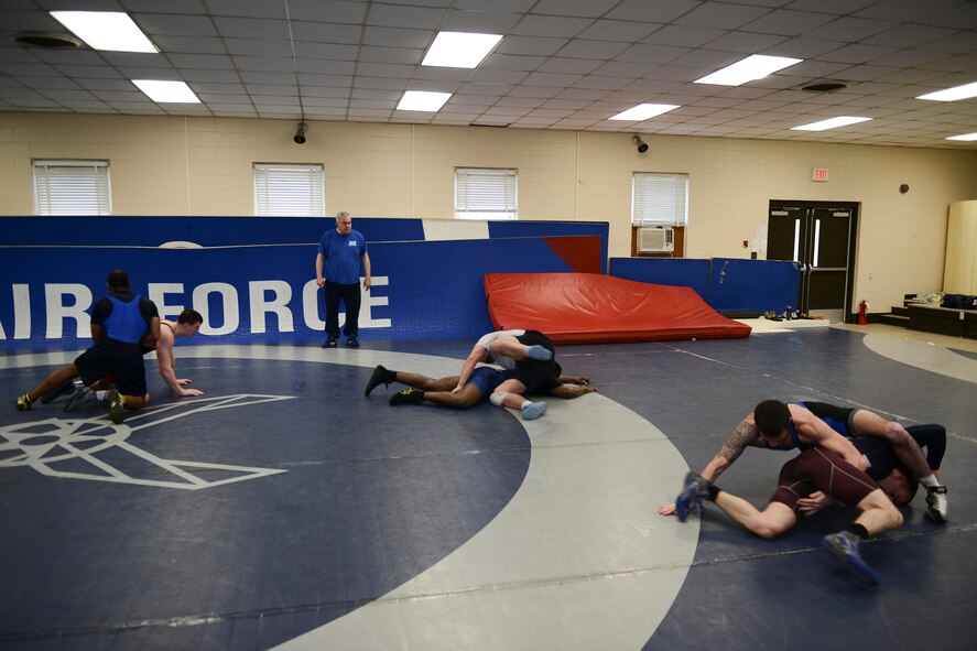 Floyd Winter, U.S. Air Force Wrestling team head coach, supervises training in the wrestling room on Joint Base McGuire-Dix-Lakehurst, N.J. March 17, 2015. This is Winter’s first year as head coach of the team. (U.S. Air Force photo by Joshua King/Released)