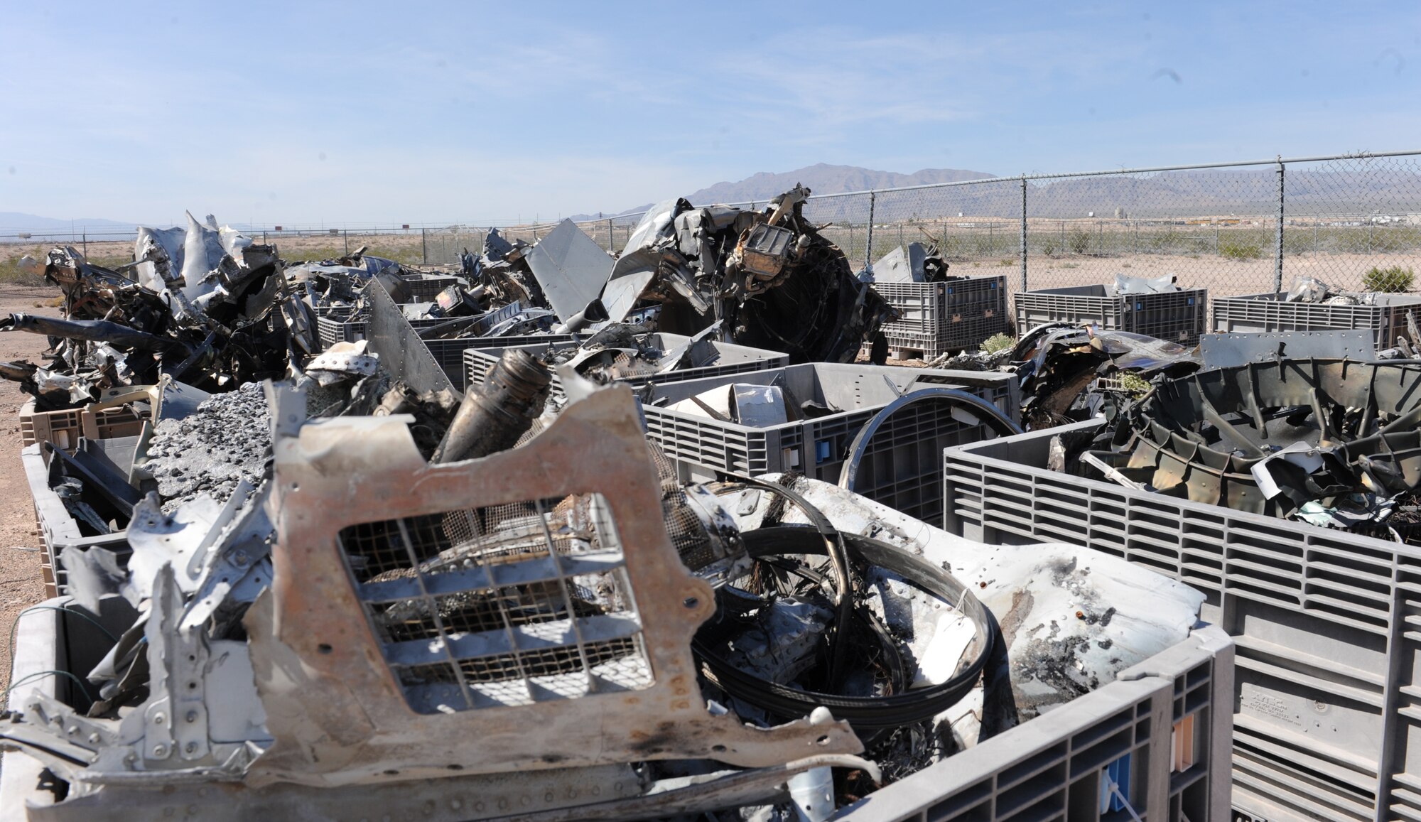 The remains of and F-15C Eagle engines’ housing rests in the crash yard at Nellis Air Force Base, Nev. March 23, 2015. Parts from military aircraft crashes near the base are gathered and laid out by flight safety to find the cause of every incident so they can educate and prevent similar mishaps in the future.  (U.S. Air Force photo by Staff Sgt. Victoria Sneed)
