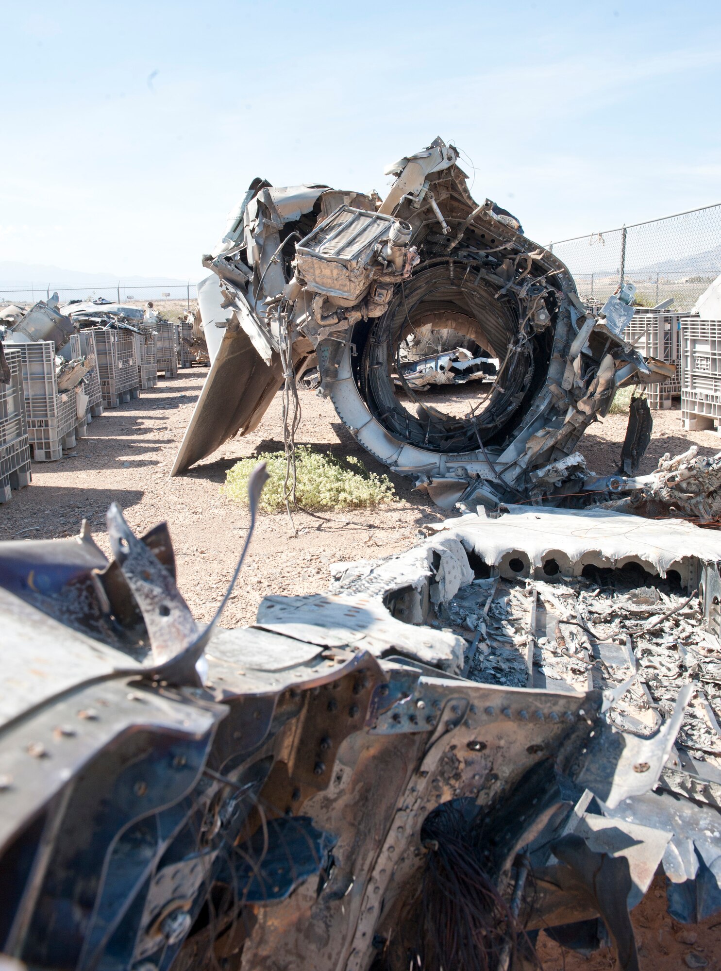 The remains of and F-15C Eagle engines’ housing rests in the crash yard at Nellis Air Force Base, Nev. March 23, 2015. Parts from military aircraft crashes near the base are gathered and laid out by flight safety to find the cause of every incident so they can educate and prevent similar mishaps in the future.  (U.S. Air Force photo by Staff Sgt. Victoria Sneed)