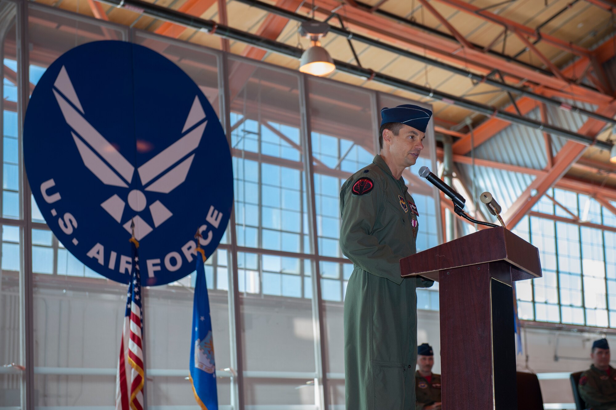 Lieutenant Colonel Marshall Chalverus, 54th Operations Support Squadron outgoing commander, delivers a speech during the 54th OSS change of command at Holloman Air Force Base, N.M., March 27, 2015. In the ceremony, Lt. Col. Jerod Rick assumed command of the 54th OSS from Lt. Col. Marshall Chalverus. The 54th OSS is a fighter training unit that trains 45 percent of all F-16 Falcon student pilots. They also manage Intelligence, Air Crew Flight Equipment, and Simulator and Training Devices. (U.S. Air Force photo by Airman 1st Class Emily Kenney / Released