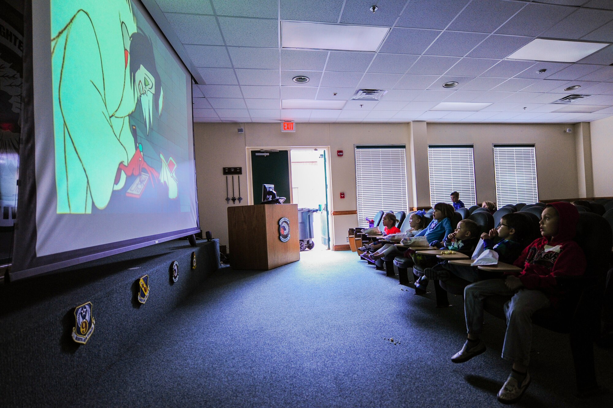Children watch a movie during a “Mom’s Day Out” event, March 14, 2015, at Seymour Johnson Air Force Base, North Carolina. Members of a fighter squadron hosted the event to give deployed spouses a chance to relax and unwind from their parental responsibilities. (U.S. Air Force photo/Senior Airman Brittain Crolley)