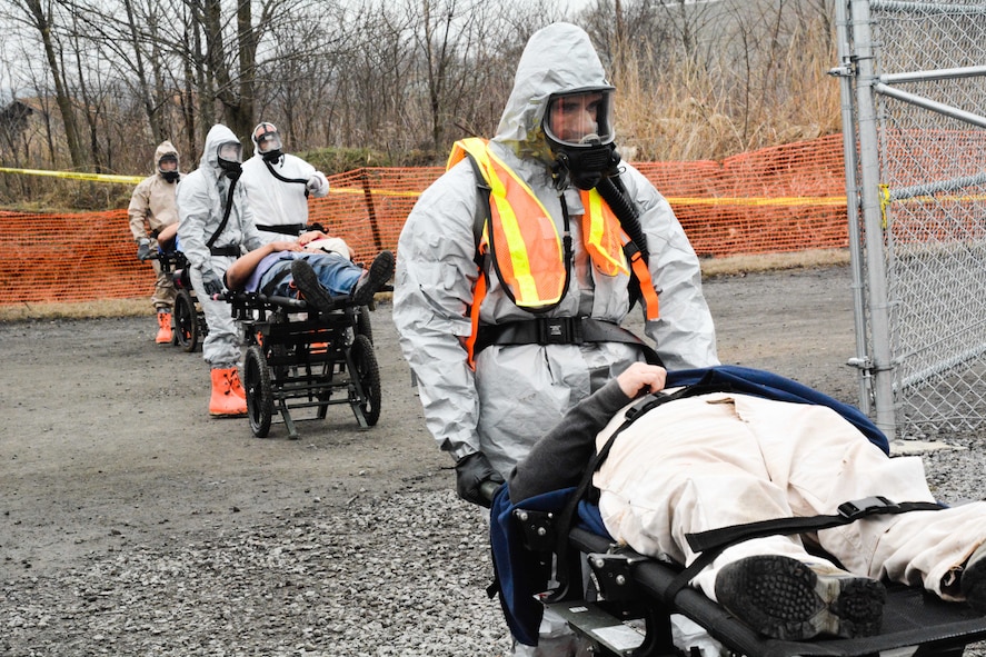 U.S. Soldiers bring in mock patients during the Missouri National Guard's Homeland Response Force exercise March 19, 2015 at Camp Gruber in Braggs, Okla. The guardsmen were evaluated on their ability to respond to a large scale natural disaster or terrorist attack. (U.S. Air National Guard photo by Airman 1st Class Chayla Hurd/Released)