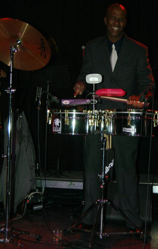 U.S. Air Force Tech. Sgt. Tomás Morales, 557th Weather Wing weather training developer, plays percussion with his band, Esencia Latina Band. They are the only Latin band in the Omaha area. (Courtesy photo)

