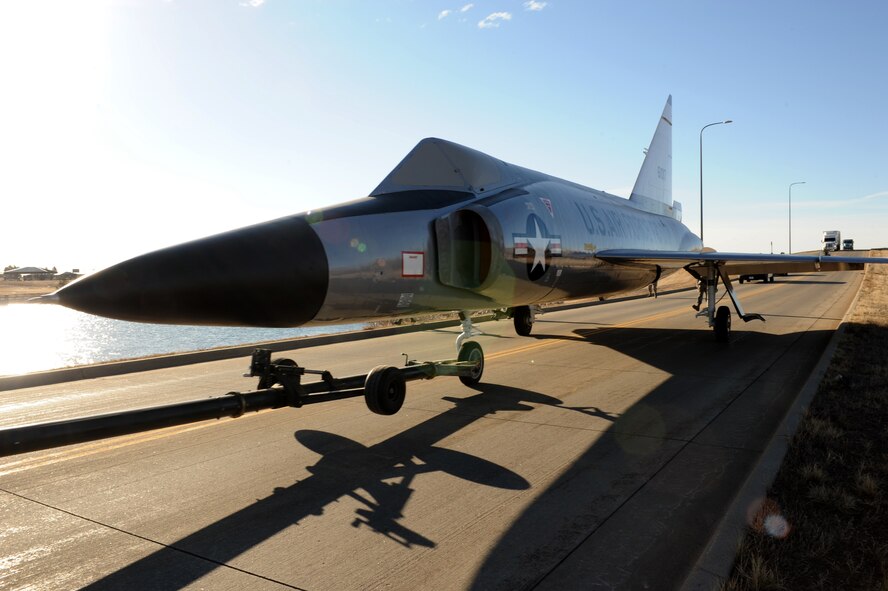 Various units from the 28th Bomb Wing transported an F-102 Delta Dagger from the flightline to the South Dakota Air and Space Museum at Ellsworth Air Force Base, S.D., March 13, 2015. The aircraft will be unveiled in its permanent spot at the museum during a ceremony in the fall of 2015. (U.S. Air Force photo by Senior Airman Hailey R. Staker/Released)