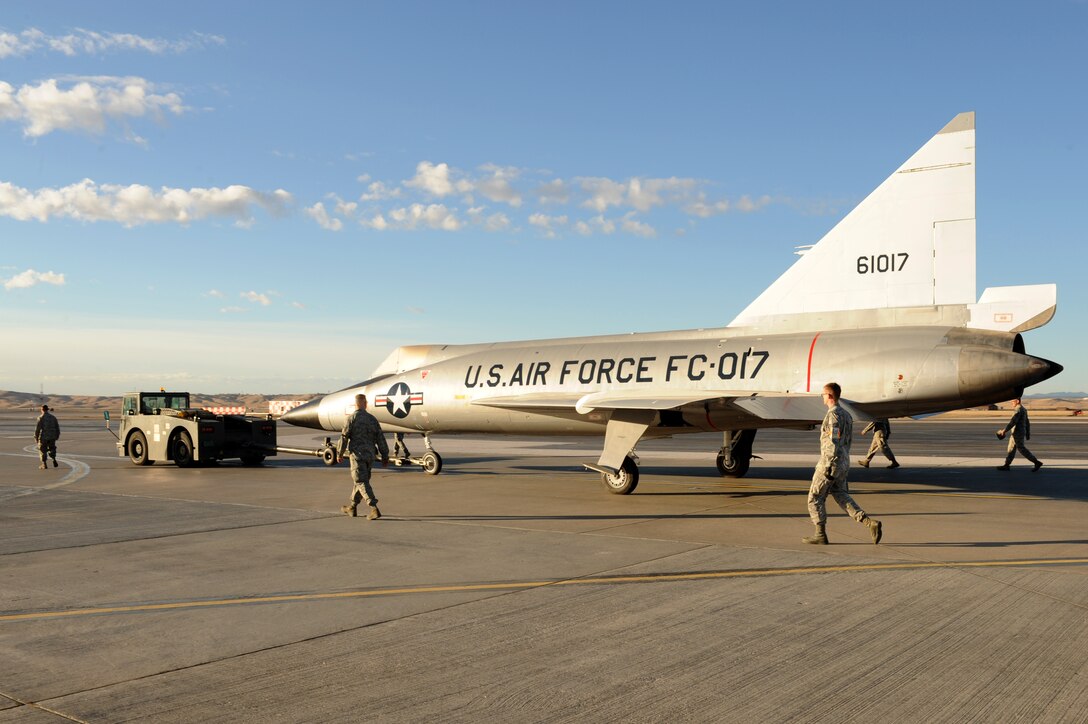 Members of the 28th Bomb Wing transport an F-102 Delta Dagger to the South Dakota Air and Space Museum at Ellsworth Air Force Base, S.D., March 13, 2015. Starting fall of 2015 it will become part of the Museum’s featured exhibits. (U.S. Air Force photo by Senior Airman Hailey R. Staker/Released)