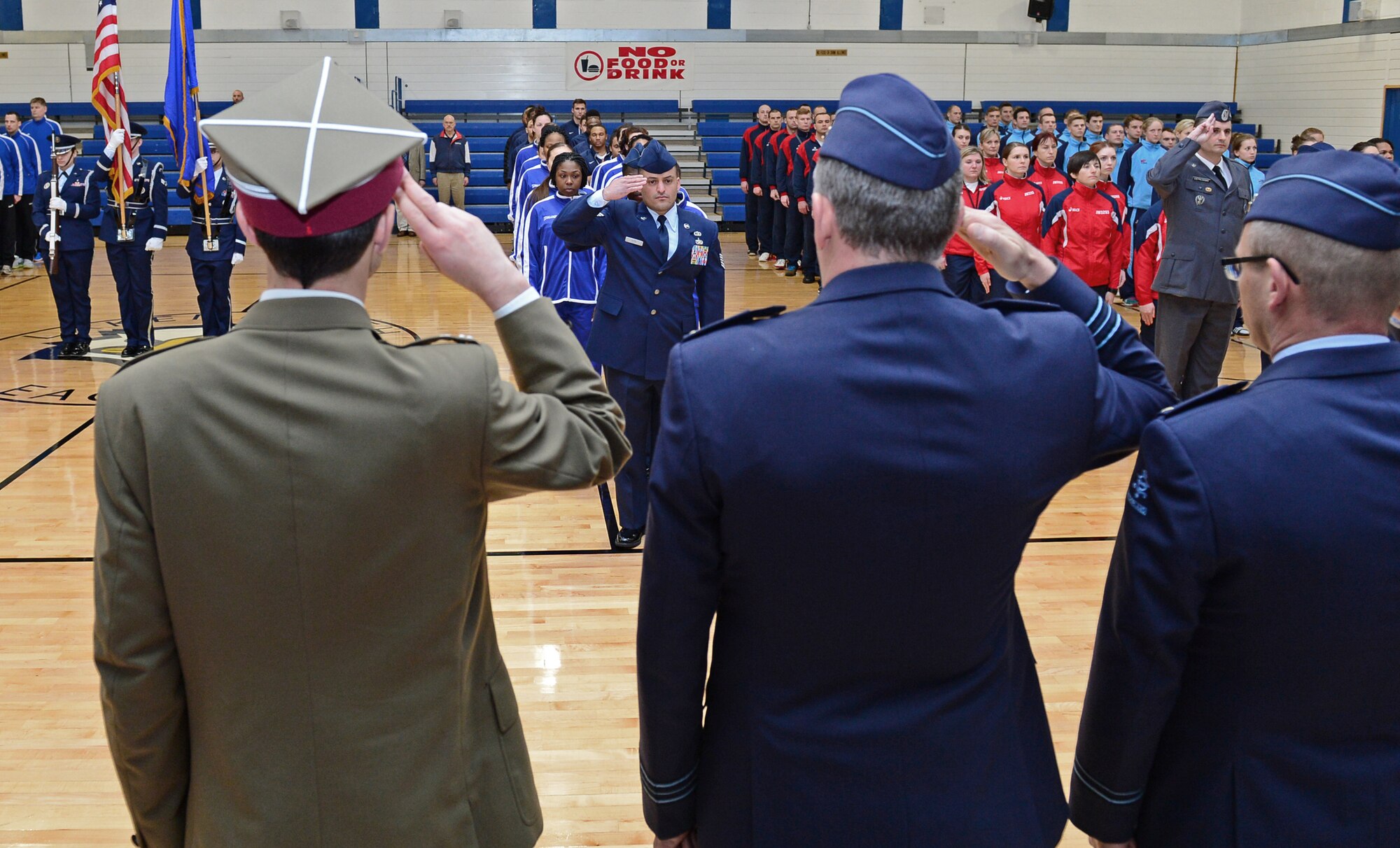 Participating members of NATO’s Inter-Nation Sports Championship stand as national anthems play during the closing ceremony at Royal Air Force Lakenheath, England, March 26, 2015. The competition reinforced the mutual respect and goodwill that exists between NATO nations. (U.S. Air Force photo by Airman 1st Class Erin R. Babis/Released)