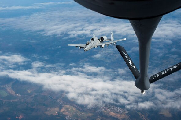 A pilot from 354th Expeditionary Fighter Squadron maneuvers away from a KC-135 Stratotanker from the 100th Air Refueling Wing, RAF Mildenhall, England, after receiving fuel above Ramstein Air Base, Germany, March 26, 2015. The A-10s deployed as part of a theater security package in support of Operation Atlantic Resolve. The deployment of fighters throughout the region brings additional combat capable forces to Europe, which are able to respond to a wide variety of operations. The Air Force’s forward presence in Europe gives the U.S. the support infrastructure to increase current force and build new and deeper partnerships across the continent. (U.S. Air Force photo/Senior Airman Damon Kasberg) 