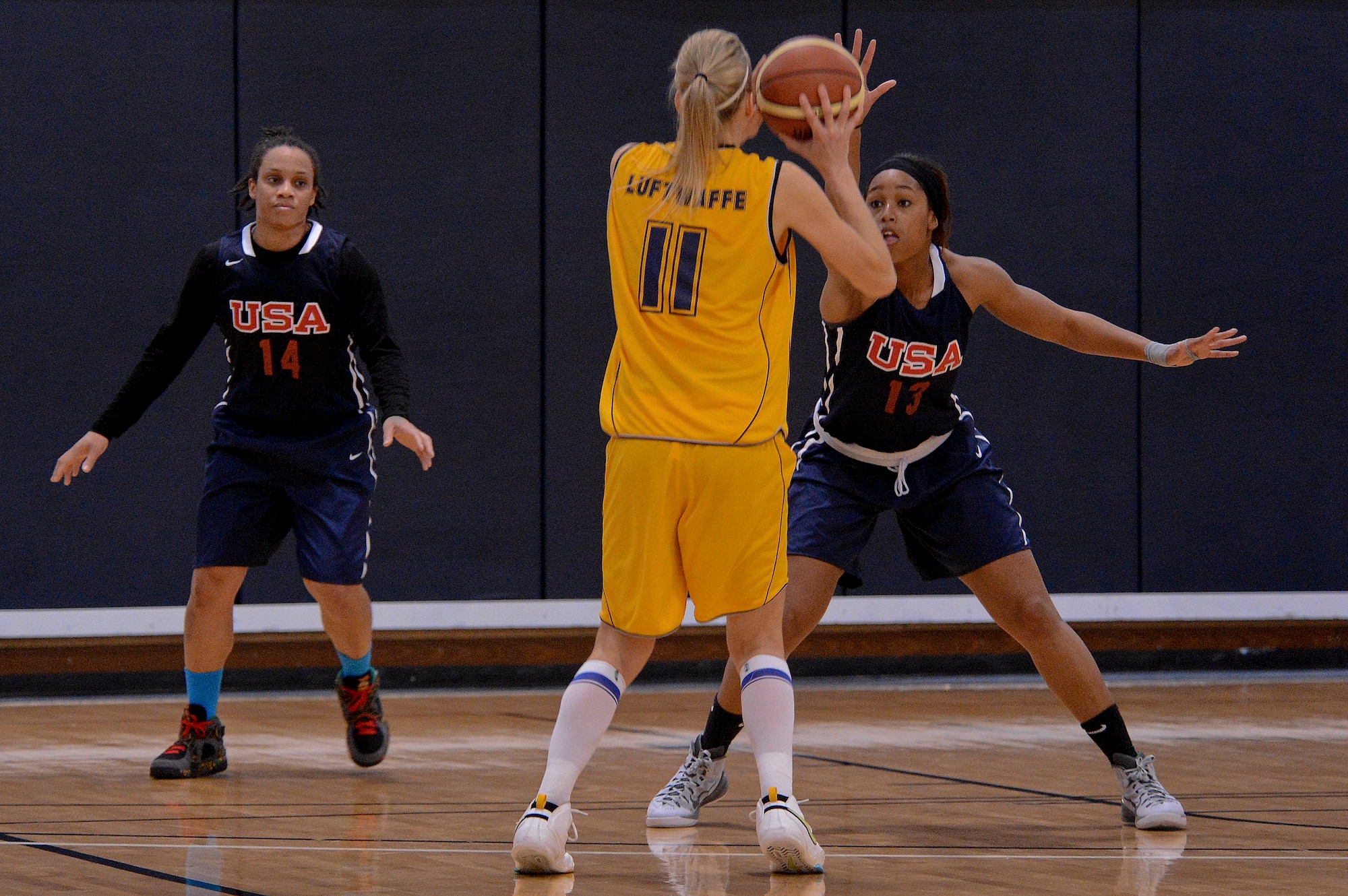 Members of the U.S. Air Force and the German air force women’s basketball teams compete during NATO’s Inter-Nation Sports Championship women’s final at Royal Air Force Lakenheath, England, March 26, 2015. The U.S. Air Force hosted this year’s event, including air forces from Belgium, Poland, the Netherlands, Germany and the U.K. (U.S. Air Force photo by Senior Airman Trevor T. McBride/Released)
