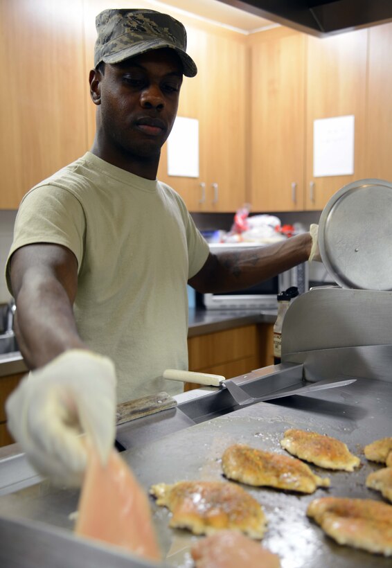 Staff Sgt. Terell Ballard, 341st Force Support Squadron senior missile chef, places chicken on a grill March 16 at a missile alert facility near Malmstrom Air Force Base, Mont. Each MAF is stocked with a variety of foods, which can be ordered of a custom menu for each meal. (U.S. Air Force photo/Airman 1st Class Dillon Johnston)