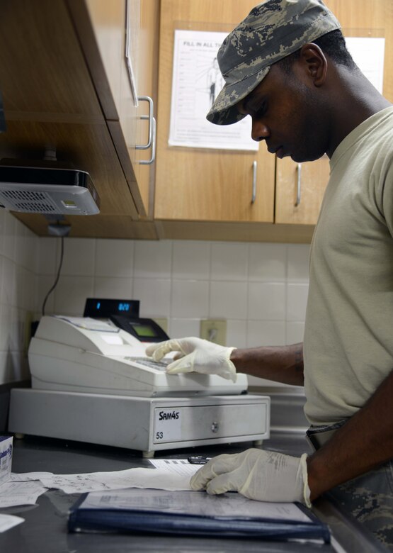 Staff Sgt. Terell Ballard, 341st Force Support Squadron senior missile chef, calculates the costs of meals March 16 at a missile alert facility near Malmstrom Air Force Base, Mont. Ballard takes orders before each meal and must collect and secure payment for them until he can return to base. (U.S. Air Force photo/Airman 1st Class Dillon Johnston)