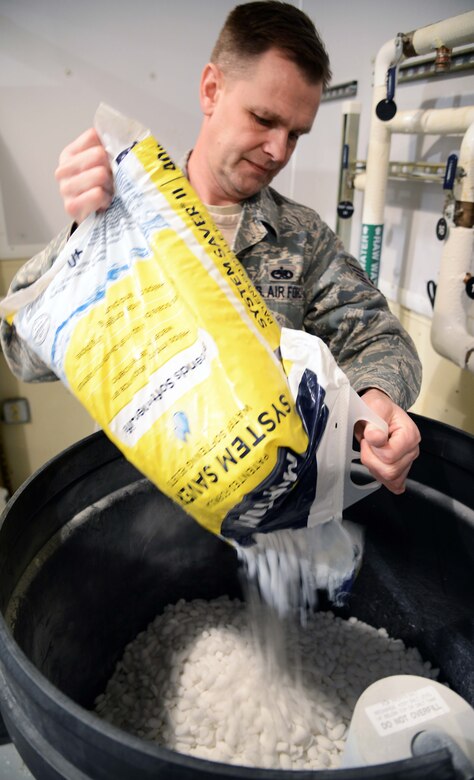 Tech. Sgt. Garry Swanson, 10th Missile Squadron facility manager, pours salt into a water filter March 16 at a missile alert facility near Malmstrom Air Force Base, Mont. Swanson is responsible for making sure all the components of the MAF function properly, and to perform routine maintenance. (U.S. Air Force photo/Airman 1st Class Dillon Johnston)