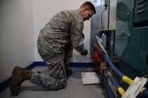 Tech. Sgt. Garry Swanson, 10th Missile Squadron facility manager, hand-cranks a fuel pump March 16 at a missile alert facility near Malmstrom Air Force Base, Mont. Swanson needed to hand-crank the pump because he was waiting on a repair for the automatic pump on the fuel tank. (U.S. Air Force photo/Airman 1st Class Dillon Johnston)