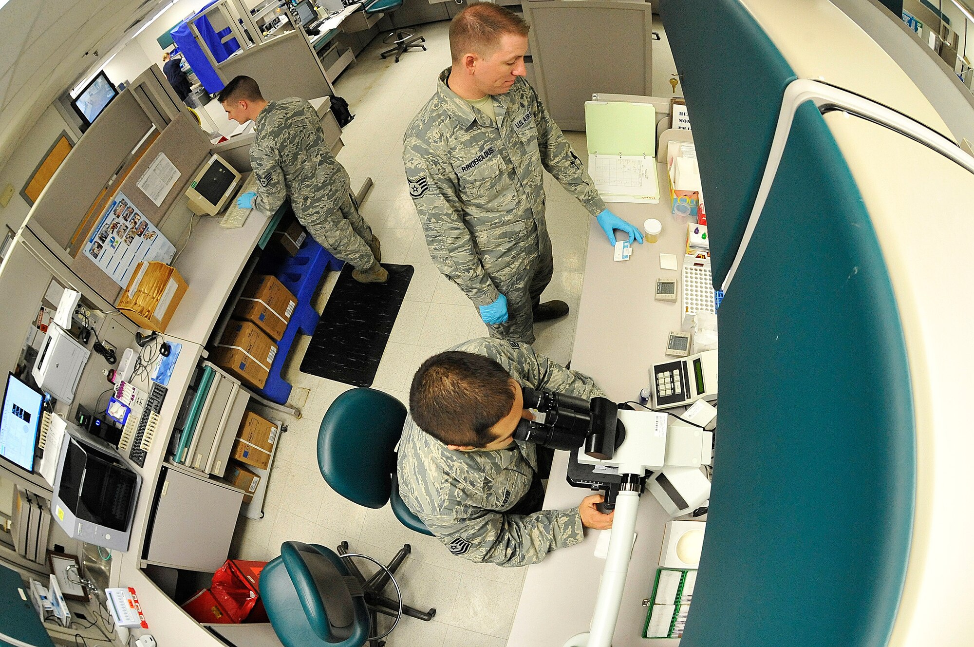 509th Medical Support Squadron lab technicians perform analytical testing at Whiteman Air Force Base, Mo., March 18, 2015. The phlebotomy lab’s mission is to provide test results to providers, ensuring accurate diagnosis for patients. (U.S. Air Force photo by Senior Airman Keenan Berry/Released)