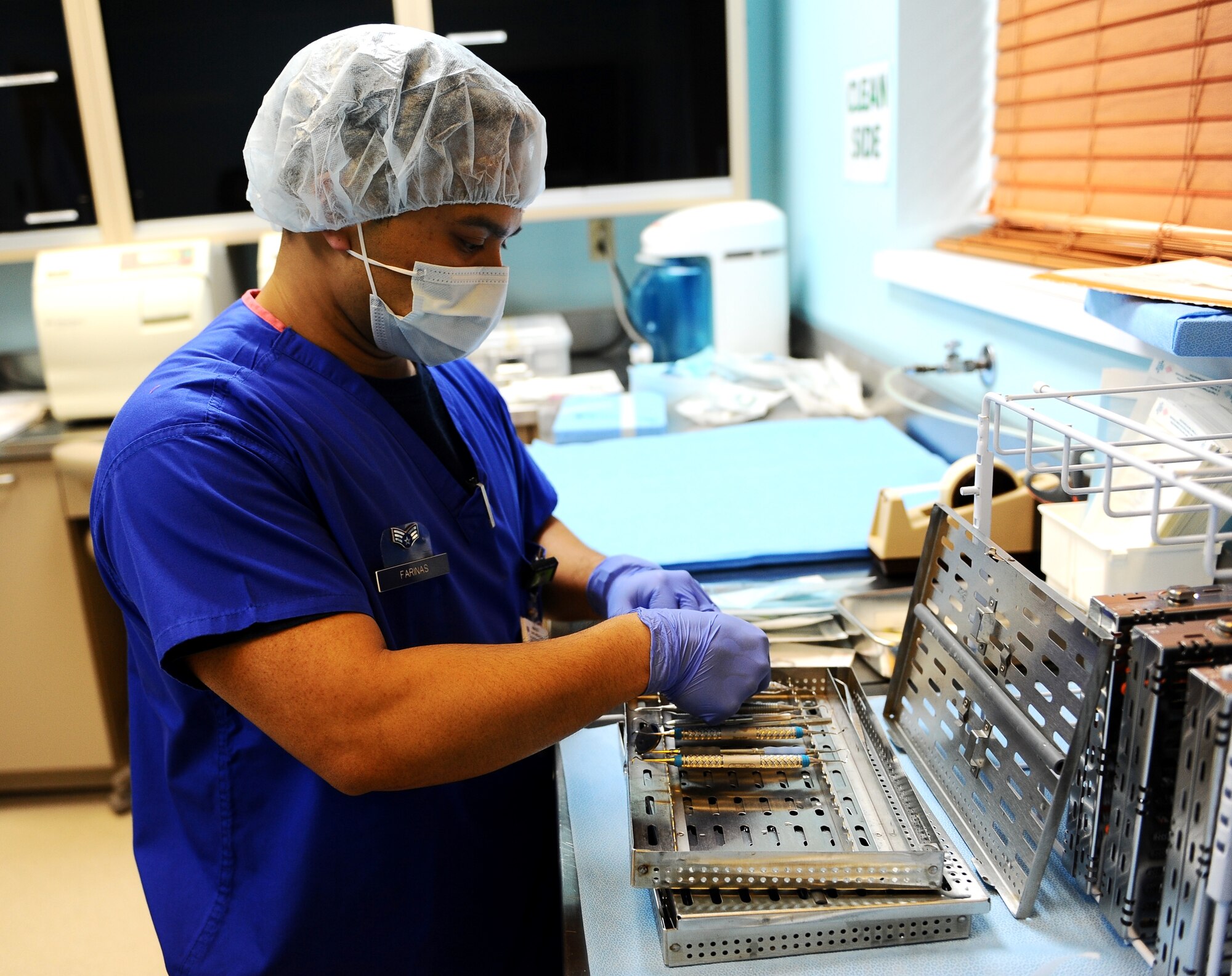 Senior Airman Nathaniel Farinas, 14th Medical Operations Squadron dental instrument processing manager, checks dental instruments for rust and contaminants March 20 at Columbus Air Force Base, Miss. The instruments go through a three-step process to ensure they are completely sterilized.   (U.S. Air Force photos/Senior Airman Kaleb Snay)