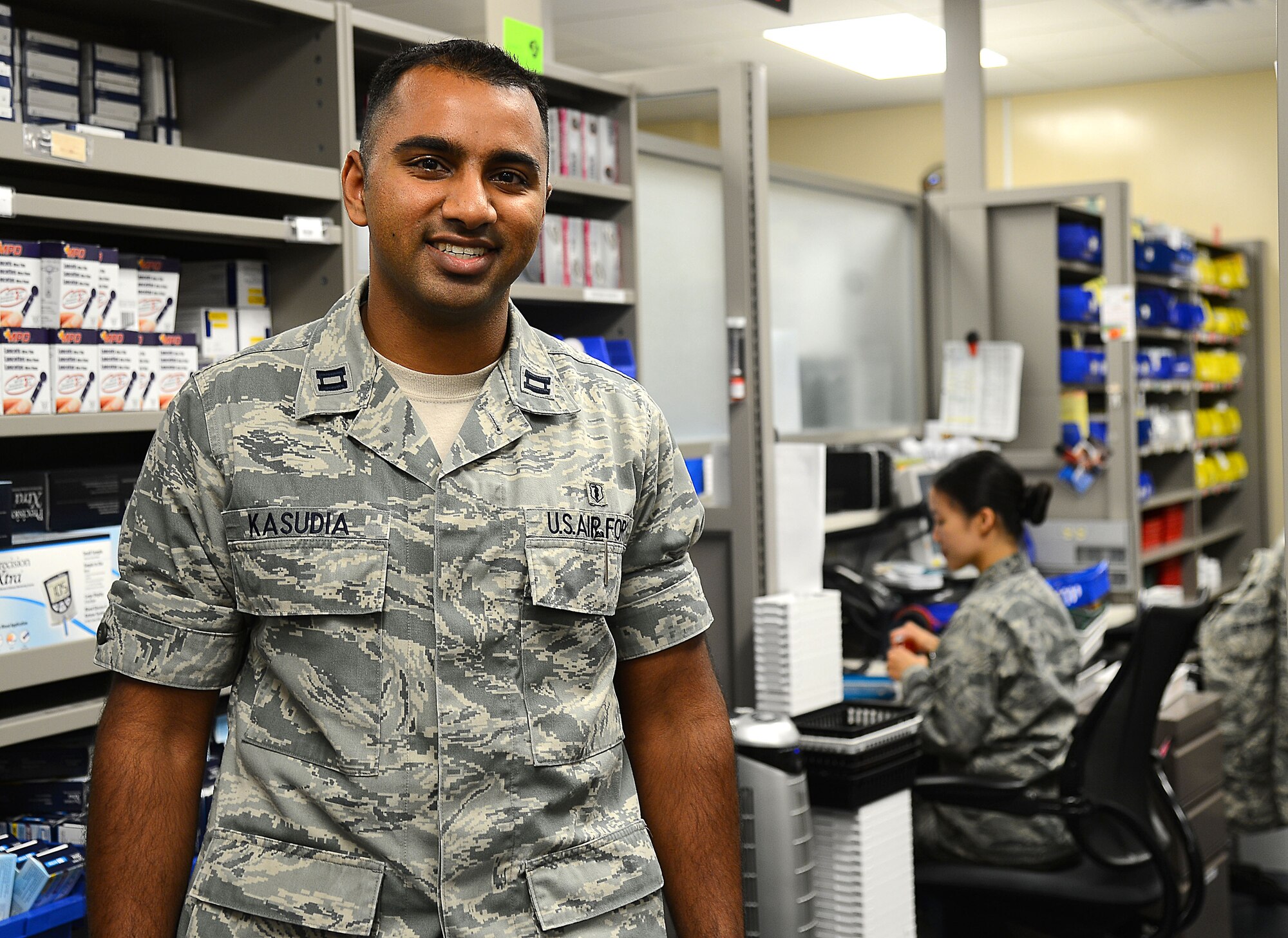 Capt. Rohin Kasudia, 6th Medical Group Satellite Pharmacy officer in charge, poses for a photo in the clinic pharmacy at MacDill Air Force Base, Fla., July 22, 2014. Kasudia won U.S. Air Force Biomedical Specialist, officer of the year in the company grade officer category. (U.S. Air Force photo by Staff Sgt. Brittany Liddon/Released)