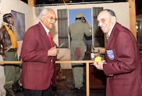 James Brynum and Dr. Eugene Derricotte, Tuskegee Airmen, cut the ribbon at the new Tuskegee Airmen exhibit at the Airmen Heritage Museum March 24, at Joint Base San Antonio- Lackland. (U.S. Air Force photo by Benjamin Faske)(released)