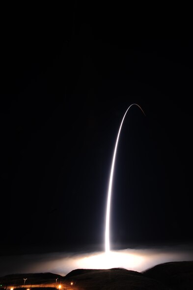 An unarmed Minuteman III intercontinental ballistic missile accelerates toward a test range near Guam March 27 after launching from Vandenberg Air Force Base. The ICBM was the second fired for testing and evaluation purposes in the course of a week, with both Malmstrom and F. E. Warren AFBs sending crews and randomly selected missiles to Vandenberg AFB to launch the missiles in conjunction with the 30th Space Wing and 576th Flight Test Squadron which oversee the launch facilities and operational tests, respectively. (U.S. Air Force photo by Joe Davila/Released)