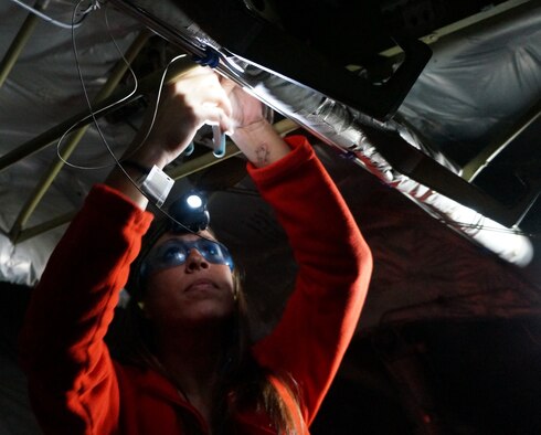 Sarah Collazo, an aircraft electrician with the 562nd Aircraft Maintenance Squadron, sees her work with running wires, disassembling, repairing, modifying and installing electronics systems and electrical components on C-17s as rewarding.(U.S. Air Force photo by Ed Aspera)