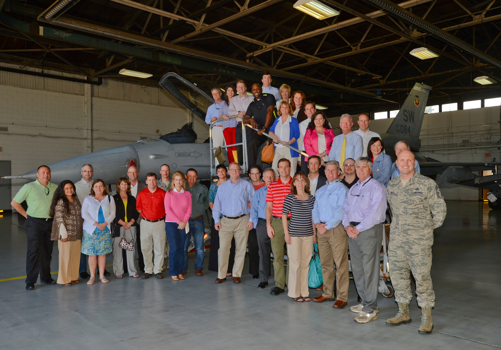 U.S. Air Force Col. Stephen Jost, 20th Fighter Wing commander, speaks with commanders and their appointed honorary commanders during lunch at the Chief Emerson Dining Facility, Shaw Air Force Base, S.C., March 17, 2015. As part of the honorary commander program, an annual tour is held to show the community Shaw AFB missions. (U.S. Air Force photo by Senior Airman Tabatha Zarrella/Released)