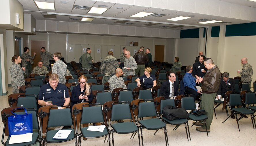 The 2015 Honorary Commanders tour the 436th Airlift Wing staff agencies Feb. 25, 2015, at Dover Air Force Base, Del. The honorary commanders received briefings at each agency they visited and had the opportunity to participate in hands-on training scenarios. (U.S. Air Force photo/Roland Balik)