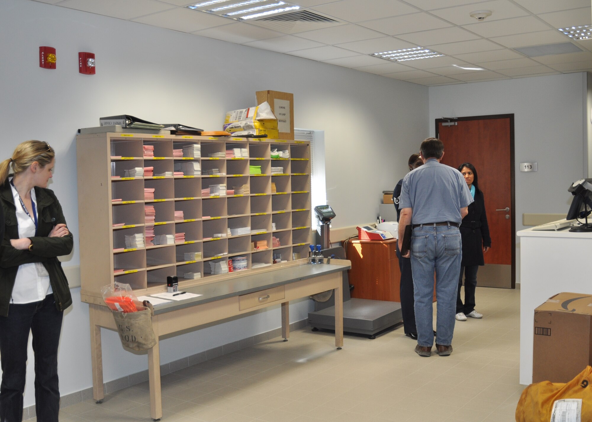 Attendees of the grand opening of Building 2621 explore the new mail room March 26, 2015, at the Ankara Support Facility in Turkey.  In addition to the Post Office, this new administrative building will also house the Traffic Management Office and the Legal Office. (U.S. Air Force photo by Capt. Laura Balch/Released) 