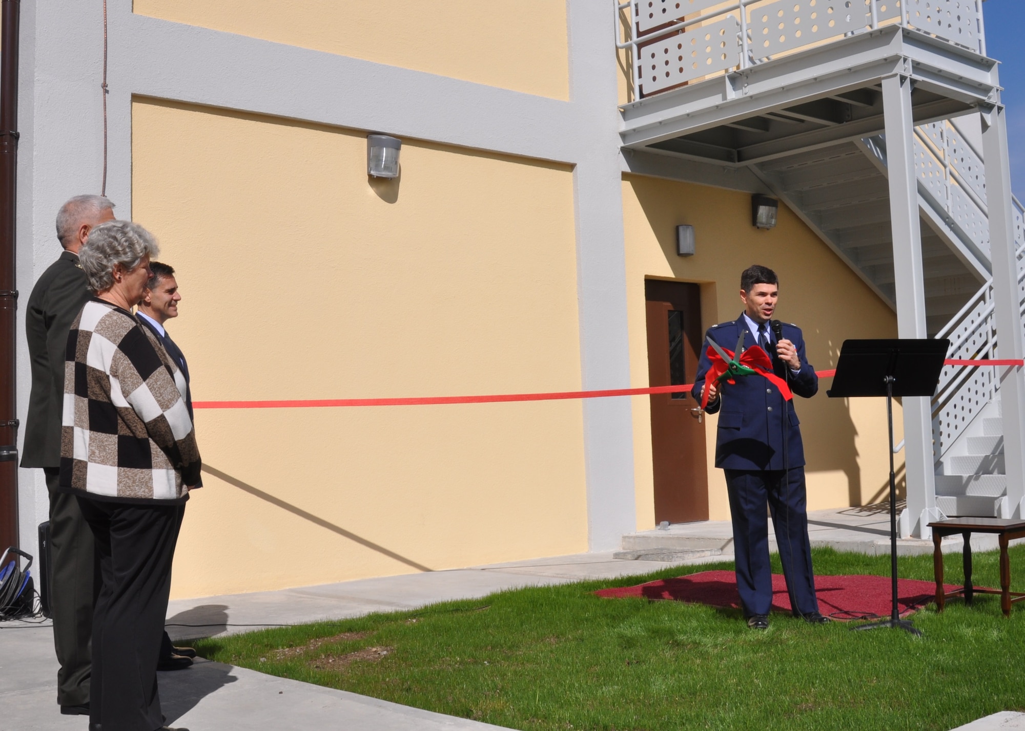 U.S. Air Force Lt. Col. Emanuel Cohan, 717th Air Base Squadron commander, prepares for the ribbon cutting ceremony March 26, 2015, at the Ankara Support Facility in Turkey. The new administrative building, number 2621, will house the Post Office, the Traffic Management Office and the Legal Office. (U.S. Air Force photo by Capt. Laura Balch/Released) 