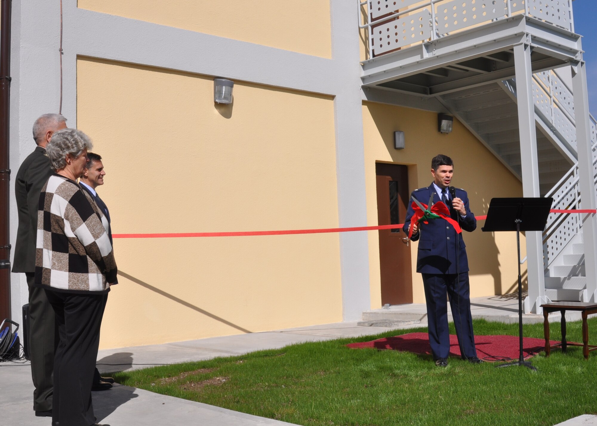 U.S. Air Force Lt. Col. Emanuel Cohan, 717th Air Base Squadron commander, prepares for the ribbon cutting ceremony March 26, 2015, at the Ankara Support Facility in Turkey. The new administrative building, number 2621, will house the Post Office, the Traffic Management Office and the Legal Office. (U.S. Air Force photo by Capt. Laura Balch/Released) 