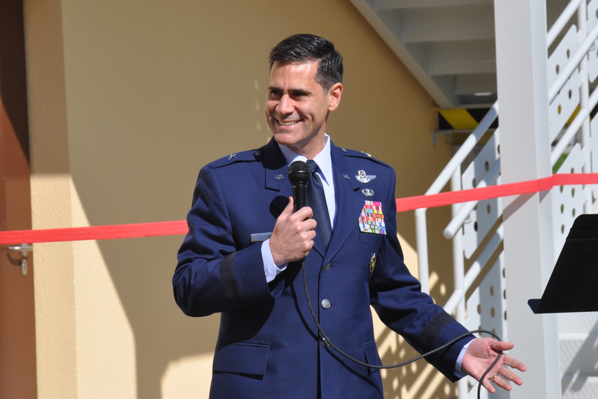 U.S. Air Force Brig. Gen. Marc Sasseville, Office of Defense Cooperation-Turkey Senior Defense Official/Defense Attaché, addresses the crowd during the grand opening of the new base administrative building March 26, 2015, at the Ankara Support Facility in Turkey. During his speech Sasseville explained how the building is certified Leadership in Energy & Environmental Design Silver. (U.S. Air Force photo by Capt. Laura Balch/Released)