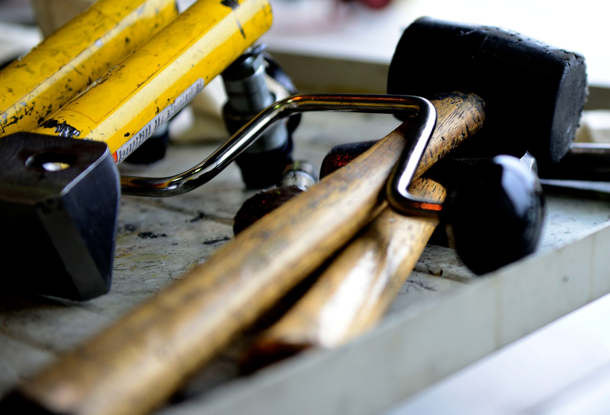 U.S. Air Force Airmen with the 31st Maintenance Squadron use various tools to remove an F-16 Fighting Falcon’s wing, March 25, 2015 at Aviano Air Base, Italy. The wing will be transported to Hill Air Force Base, Utah, where it will be overhauled and refurbished. (U.S. Air Force photo by Senior Airman Areca T. Wilson/Released)