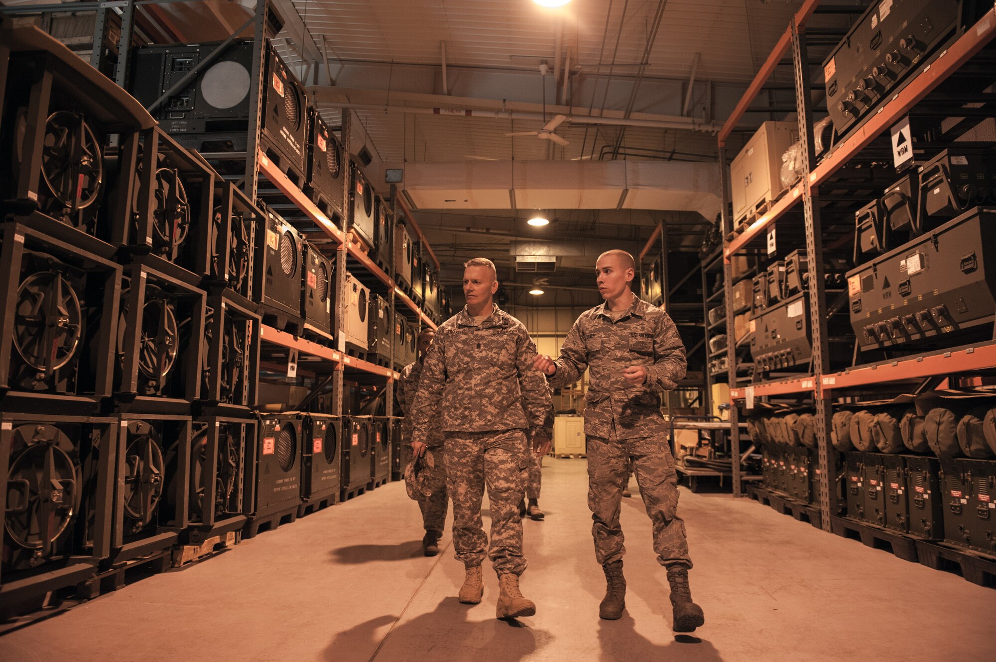 Senior Airman Travis Exner, 8th Medical Support Squadron war reserve material warehouse technician, gives a tour of the facility to Army Sgt. Maj. John Troxell, U.S. Forces Korea Command Sgt. Maj., during Troxell’s visit to Kunsan Air Base, Republic of Korea, March 23, 2015. During his visit, Troxel saw how the Wolf Pack contributes to deterring aggression on the Korean Peninsula and remains ready to fight tonight. (U.S. Air Force photo by Senior Airman Taylor Curry/Released)