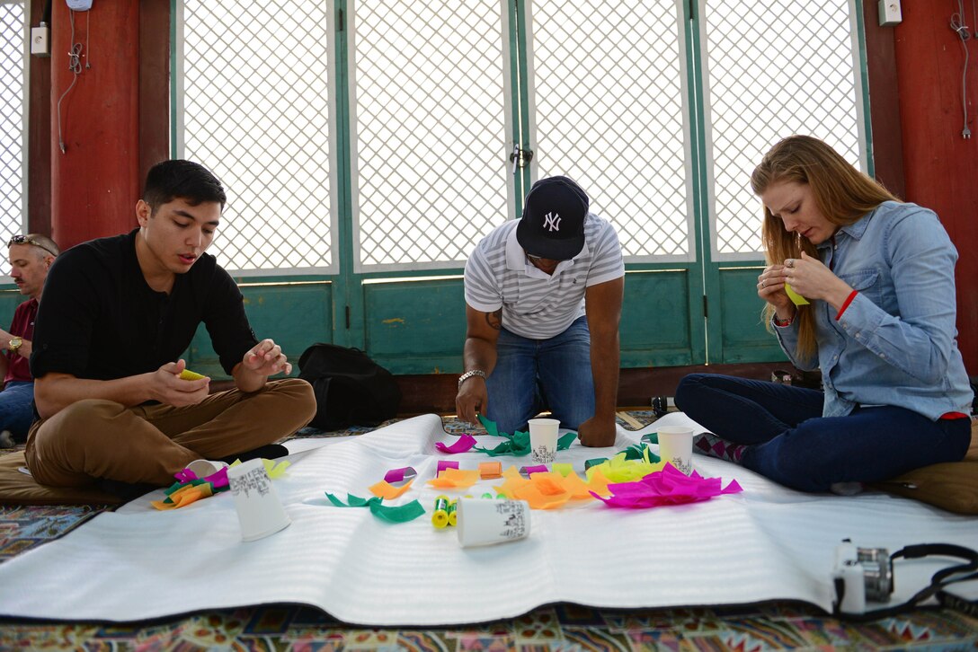 Airmen make lotus flower lanterns during a visit to the Geumsansa Temple at Moaksan Mountain, Republic of Korea, March 21, 2015. Airmen walked the interior of the buildings, viewing Buddhist artworks and treasures, and learned about 1700 years of the temple’s history.   (U.S. Air Force photo by Senior Airman Taylor Curry/Released) 