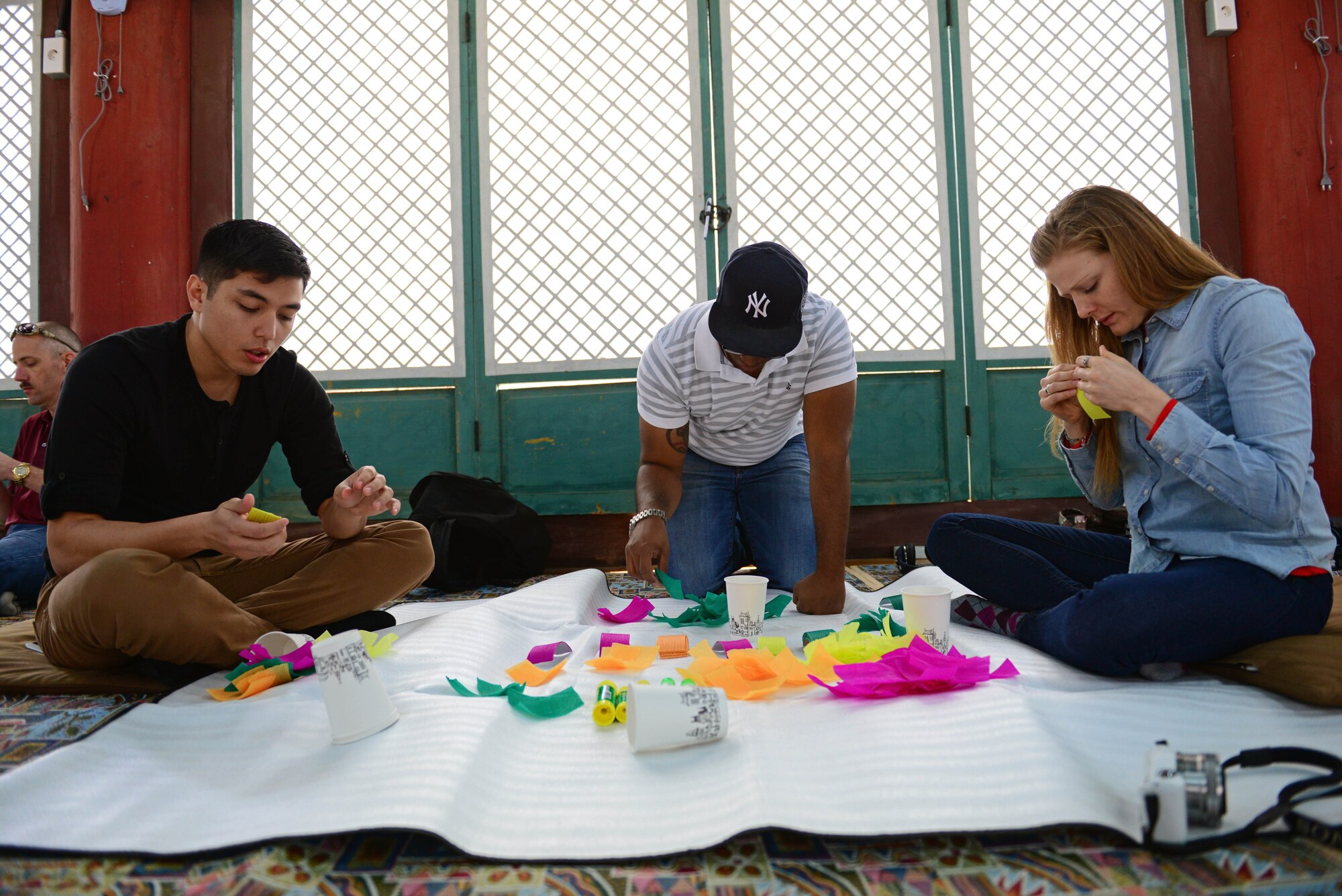 Airmen make lotus flower lanterns during a visit to the Geumsansa Temple at Moaksan Mountain, Republic of Korea, March 21, 2015. Airmen walked the interior of the buildings, viewing Buddhist artworks and treasures, and learned about 1700 years of the temple’s history.   (U.S. Air Force photo by Senior Airman Taylor Curry/Released) 