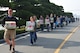 Father Edward Ramatowski (left), 8th Fighter Wing chaplain, leads 35 volunteers from Kunsan Air Base to the Moses Infant Home carrying 32 boxes of donated diapers and wet wipes in Gunsan City, Republic of Korea, March 21, 2015. Thirty-five members from the 8th Fighter Wing and the deployed 120th Expeditionary Aircraft Maintenance Unit visited the children’s home to spend time with the 30 children living there. (U.S. Air Force photo by Capt. Reba Good/Released)