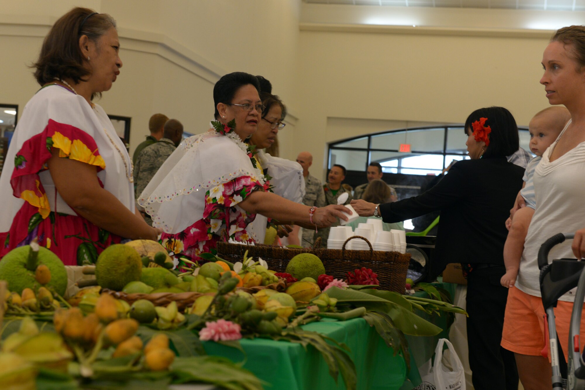 Team Andersen members are treated to local foods during a Chamorro Month presentation March 27, 2015, at Andersen Air Force Base, Guam. Team Andersen members observed different aspects of the Chomorro culture during the presentation. (U.S. Air Force photo by Airman 1st Class Joshua Smoot/Released)