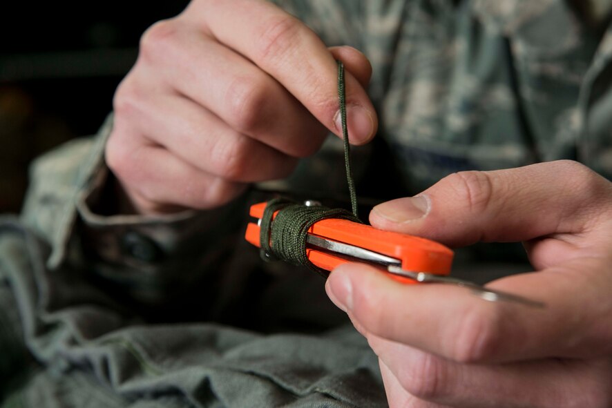 An MC-1 hook blade knife is prepared for installment in a 13th Fighter Squadron pilot’s Anti-G suit before a sortie March 26, 2015, at Misawa Air Base, Japan. The 35th Operations Support Squadron's aircrew flight equipment flight prepares the gear all F-16 Fighting Falcon pilots fly with, including items like their helmet and mask, survival vest, anti-exposure suit and harness. (U.S. Air Force photo by Staff Sgt. Derek VanHorn/Released) 