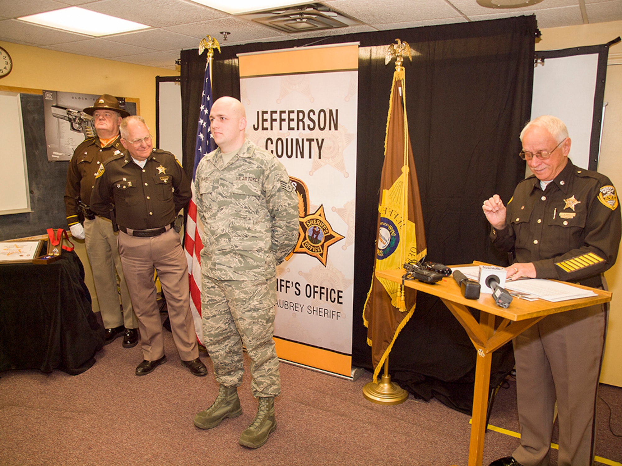 Staff Sgt. Brent Reichardt, an aircraft hydraulics specialist in the Kentucky Air National Guard's 123rd Maintenance Squadron, was awarded the Medal of Valor from the Jefferson County Sheriff’s Office on Feb. 20, 2015, for actions he took during a shooting incident at a Louisville, Ky., high school in 2014. Reichardt, who works full-time as a Jefferson County Sheriff’s deputy, is currently deployed to the Persian Gulf in support of airlift operations across the U.S. Central Command Area of Responsibility. (Photo courtesy Jefferson County Sheriff's Office)