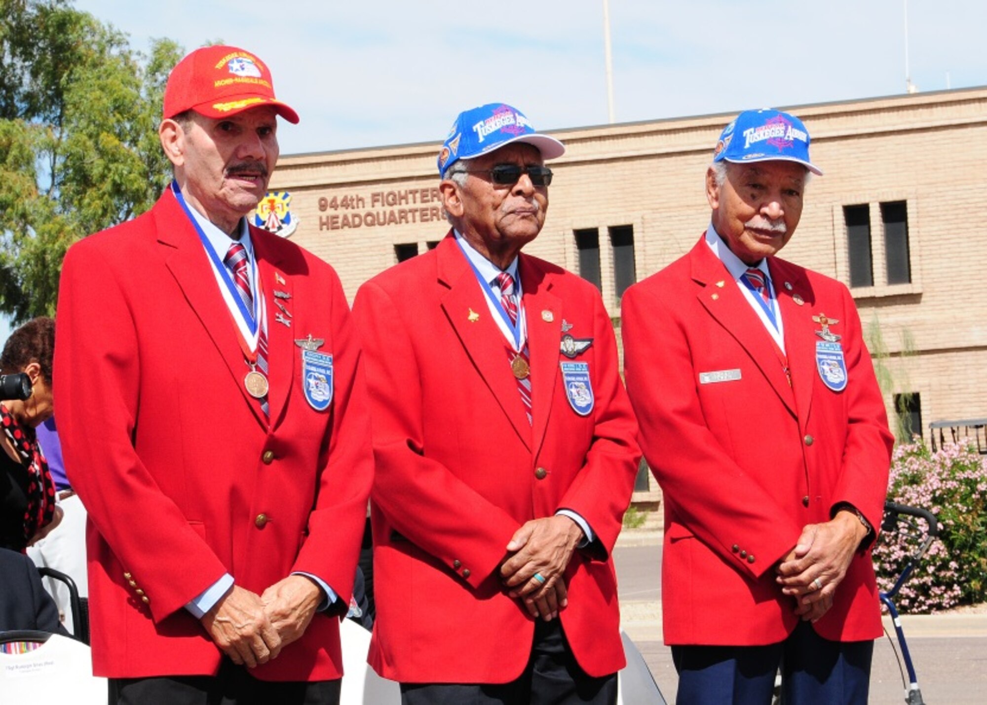 Master Sgt. (Ret.) Rudolf Silas, Lt. Col. (Ret.) Asa Herring, and Lt. Col. (Ret.) Robert Ashby, original Tuskegee Airmen, stand to be recognized during the Tuskegee Airmen Commemoration Day ceremony Mar 26 at Luke Air Force Base, Ariz. (U.S. Air Force photo taken by Tech. Sgt. Louis Vega Jr.)