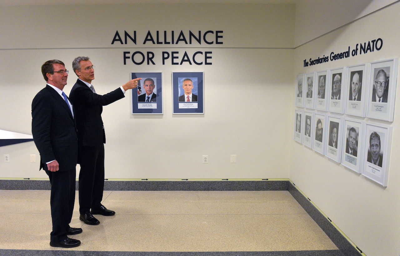 Defense Secretary Ash Carter, left, and NATO Secretary General Jens Stoltenberg observe the display honoring the NATO alliance during a tour of the Pentagon, March 26, 2015. DoD photo by Glenn Fawcett