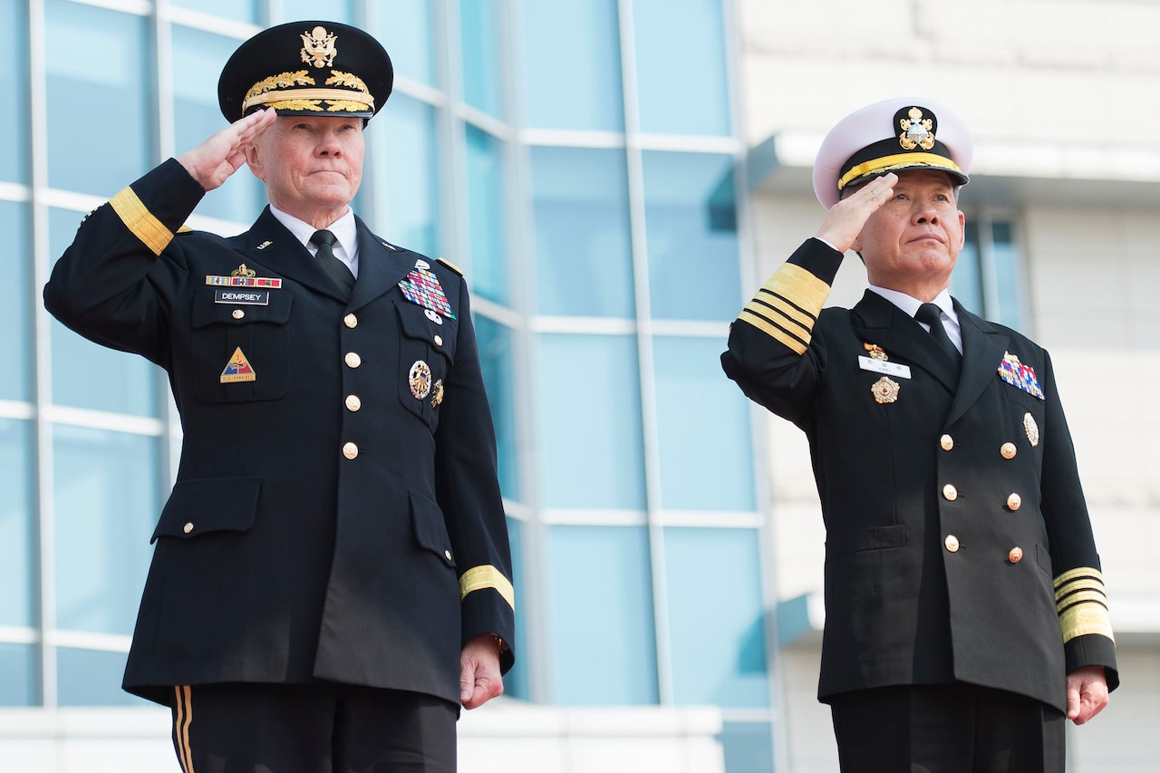 U.S. Army Gen. Martin E. Dempsey, left, chairman of the Joint Chiefs of Staff, and his South Korean counterpart, Adm. Choi Yun-hee, salute during an honor ceremony at the South Korean Joint Chiefs of Staff headquarters in Seoul, South Korea, March 27, 2015. Dempsey is visiting Seoul as part of a two-day trip to reinforce the U.S.-South Korean alliance. DoD photo by U.S. Navy Petty Officer 1st Class Daniel Hinton