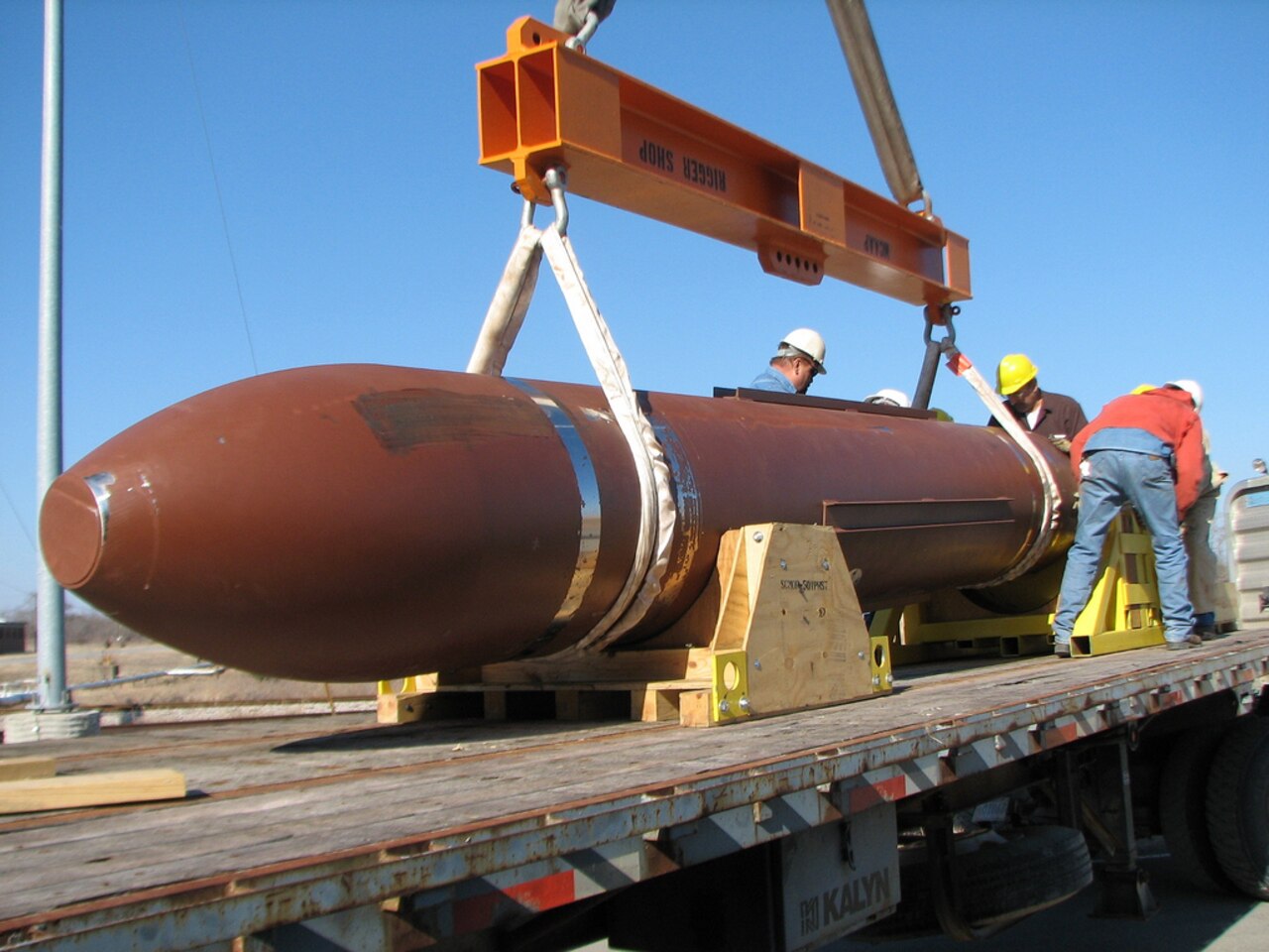 Defense Threat Reduction Agency test personnel prepare to carefully offload the 30,000-pound massive ordnance penetrator, or MOP, for a static test at White Sands Missile Range, N.M. DTRA photo